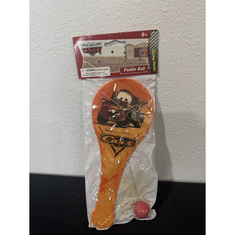 DISNEY PIXAR CARS Mater MOVIE PLASTIC PADDLE BALL RACING SERIES NEW IN PACKAGE